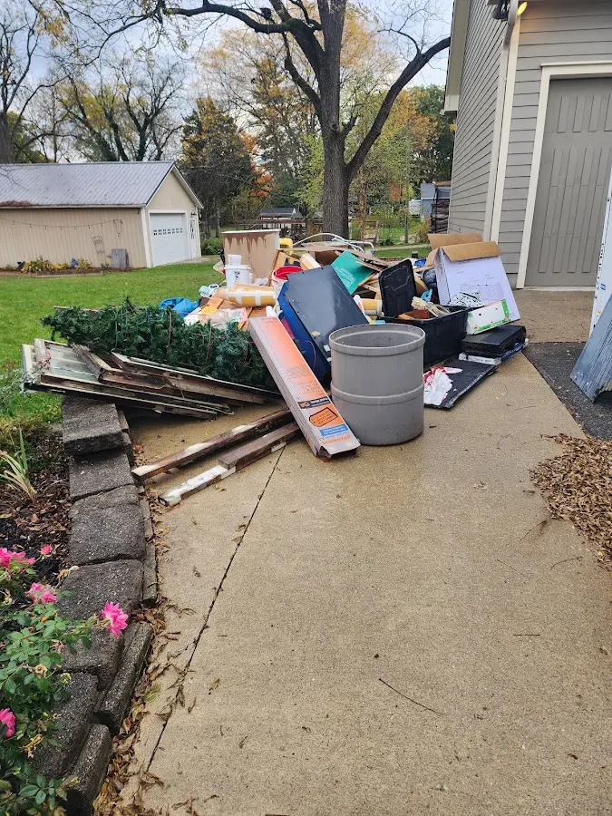 Dumpster being loaded with debris for Estate Cleanout Dumpster Rental in Cornwall